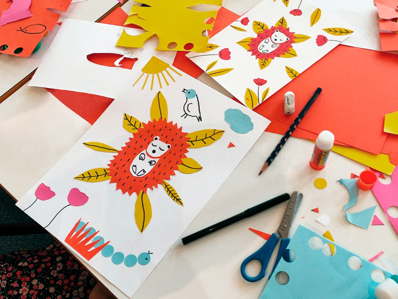 scène d'atelier artistique de création d'un hérisson en papier découpé pour les enfants